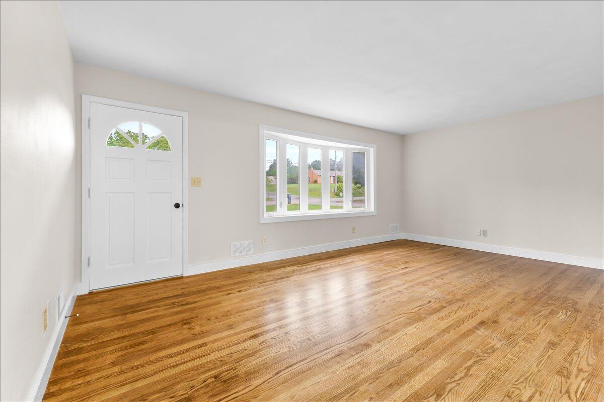 2646 Dickerson Mill Road Bedford, VA 24523 - Photo 7 of 46 an empty room with windows