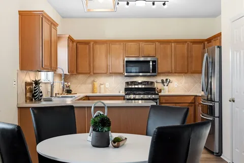 a kitchen with a sink a stove and appliances