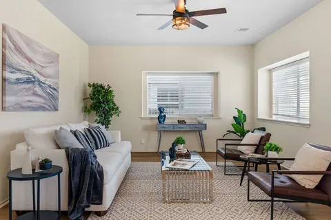 a living room with furniture and a large window