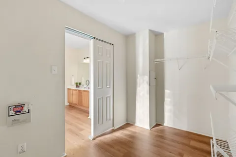 a view of a bathroom with wooden floor