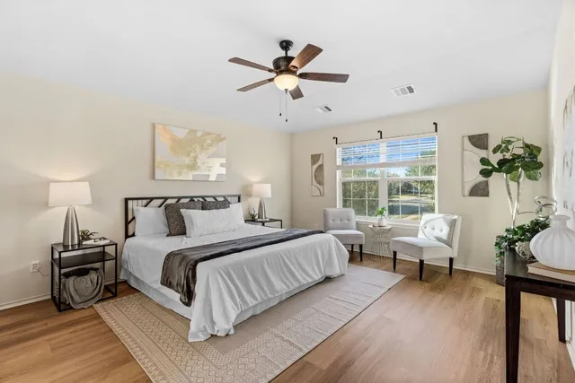 a bedroom with bed and a window