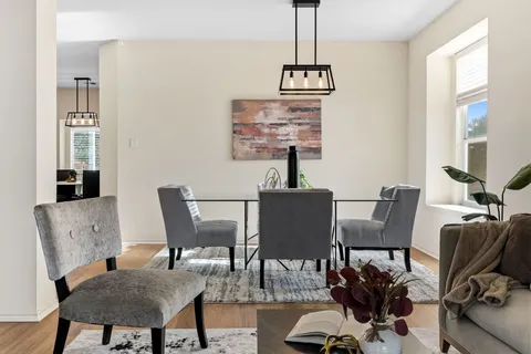 a view of a dining room with furniture window and outside view