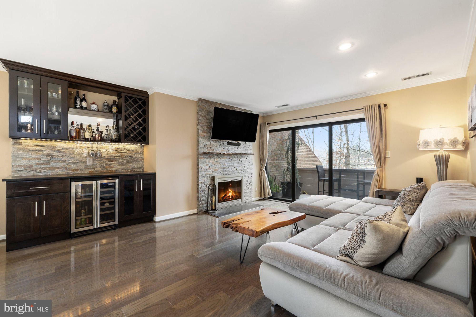 11120 Harbor Court, Unit 1120 Reston, VA 20191 - Photo 1 of 55 a living room with furniture fireplace and window