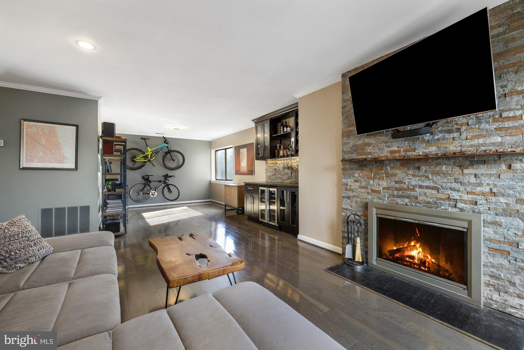 11120 Harbor Court, Unit 1120 Reston, VA 20191 - Photo 13 of 55 a living room with furniture fireplace and flat screen tv