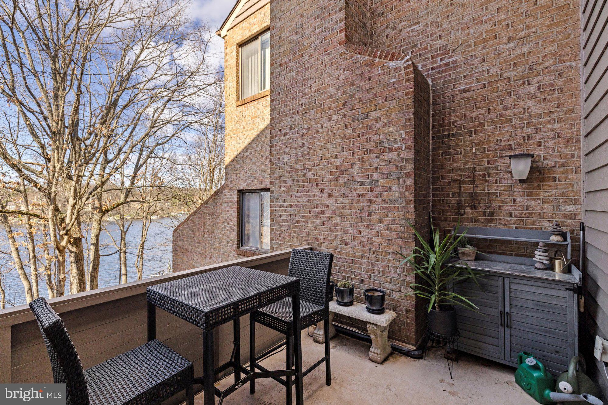 11120 Harbor Court, Unit 1120 Reston, VA 20191 - Photo 24 of 55 a backyard of a house with barbeque oven and outdoor seating