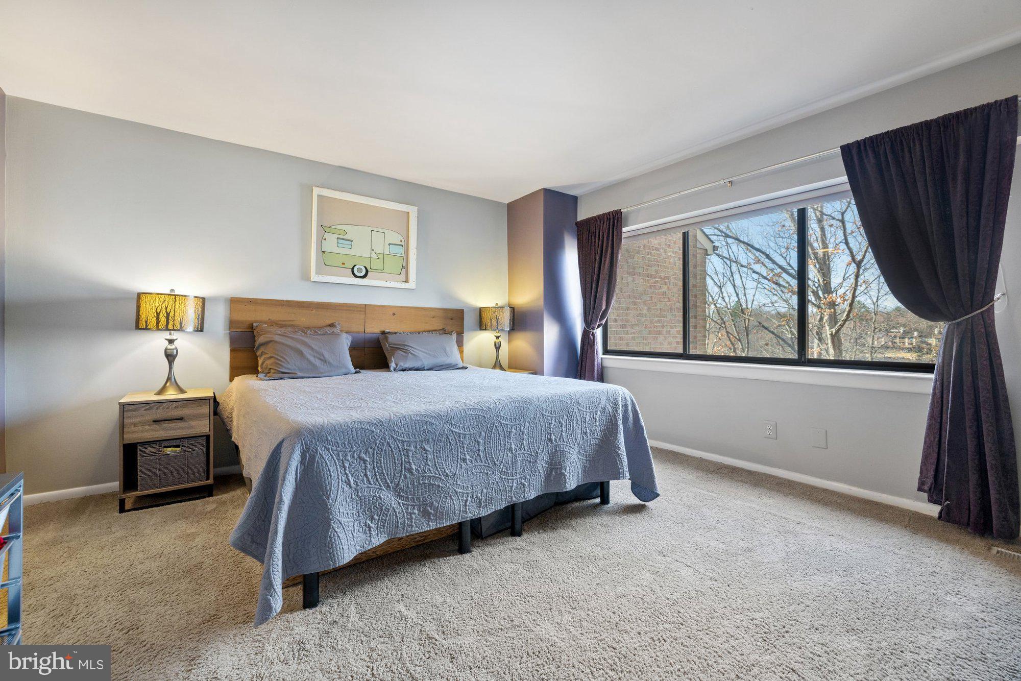 11120 Harbor Court, Unit 1120 Reston, VA 20191 - Photo 27 of 55 a bedroom with a large bed and a window