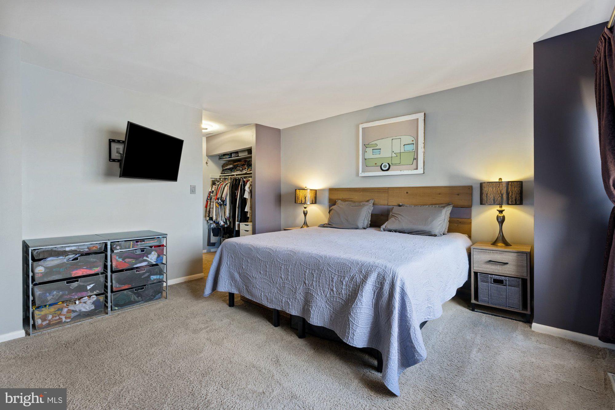 11120 Harbor Court, Unit 1120 Reston, VA 20191 - Photo 29 of 55 a bedroom with a bed and a flat screen tv