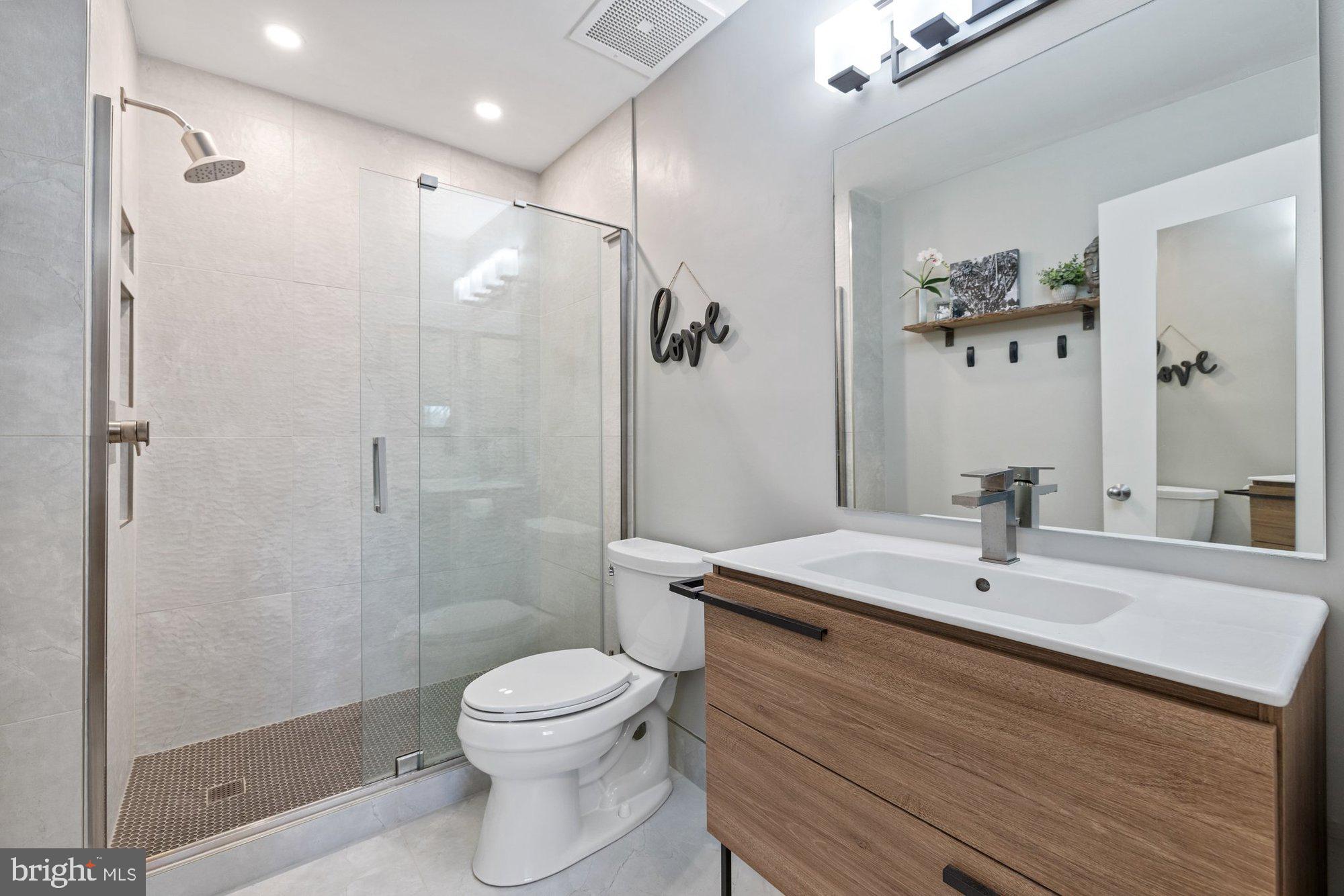 11120 Harbor Court, Unit 1120 Reston, VA 20191 - Photo 31 of 55 a bathroom with a sink a toilet and shower