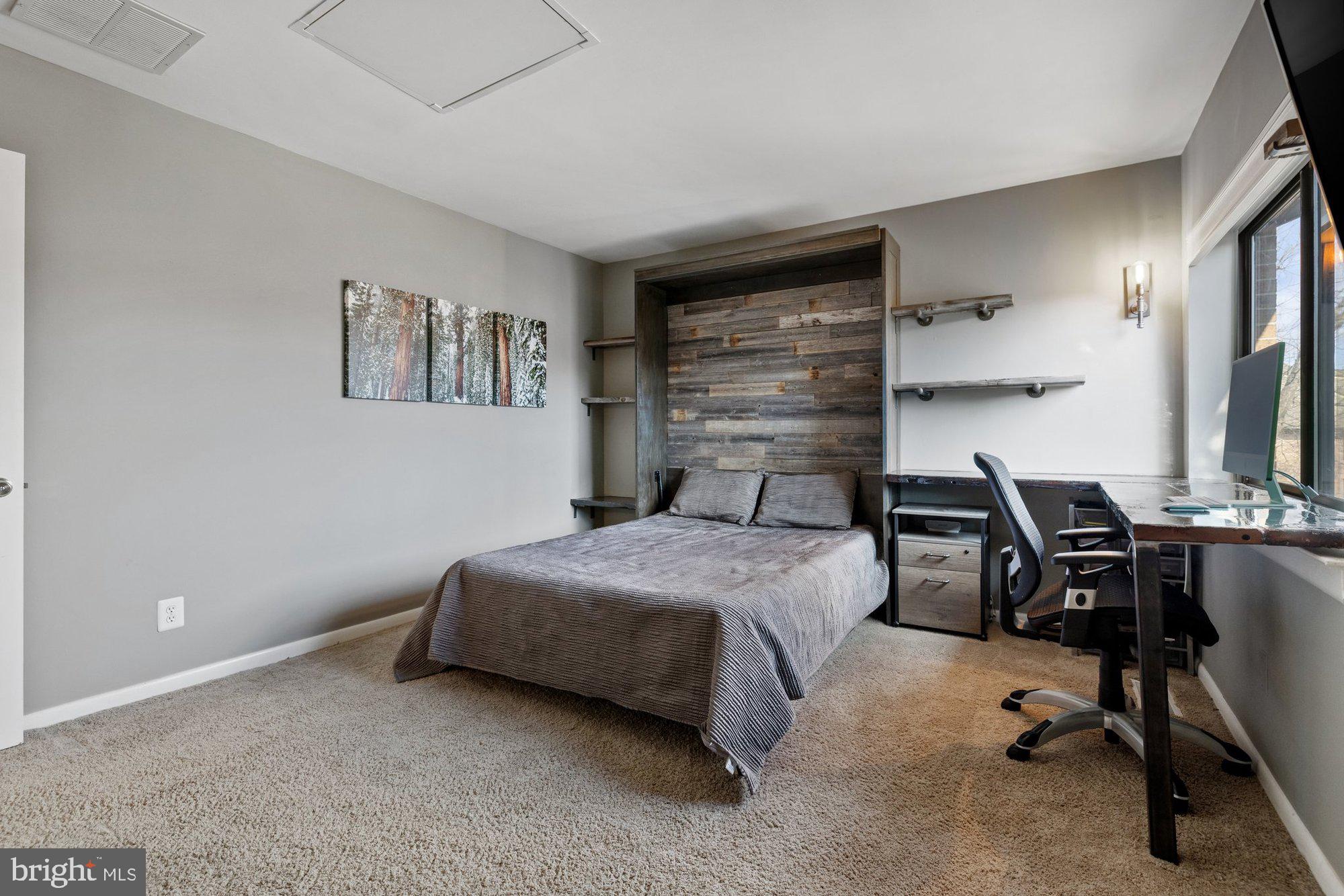 11120 Harbor Court, Unit 1120 Reston, VA 20191 - Photo 34 of 55 a bedroom with a bed a desk and chair