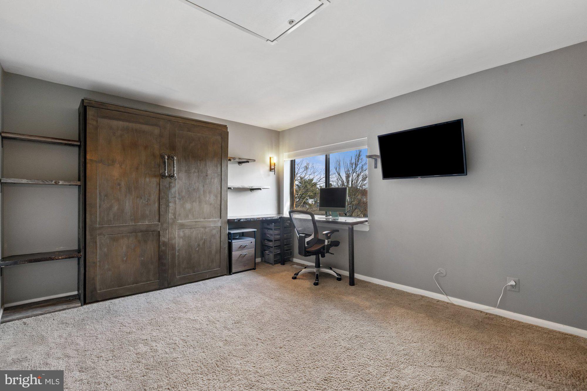 11120 Harbor Court, Unit 1120 Reston, VA 20191 - Photo 35 of 55 a view of a livingroom with workspace and a window