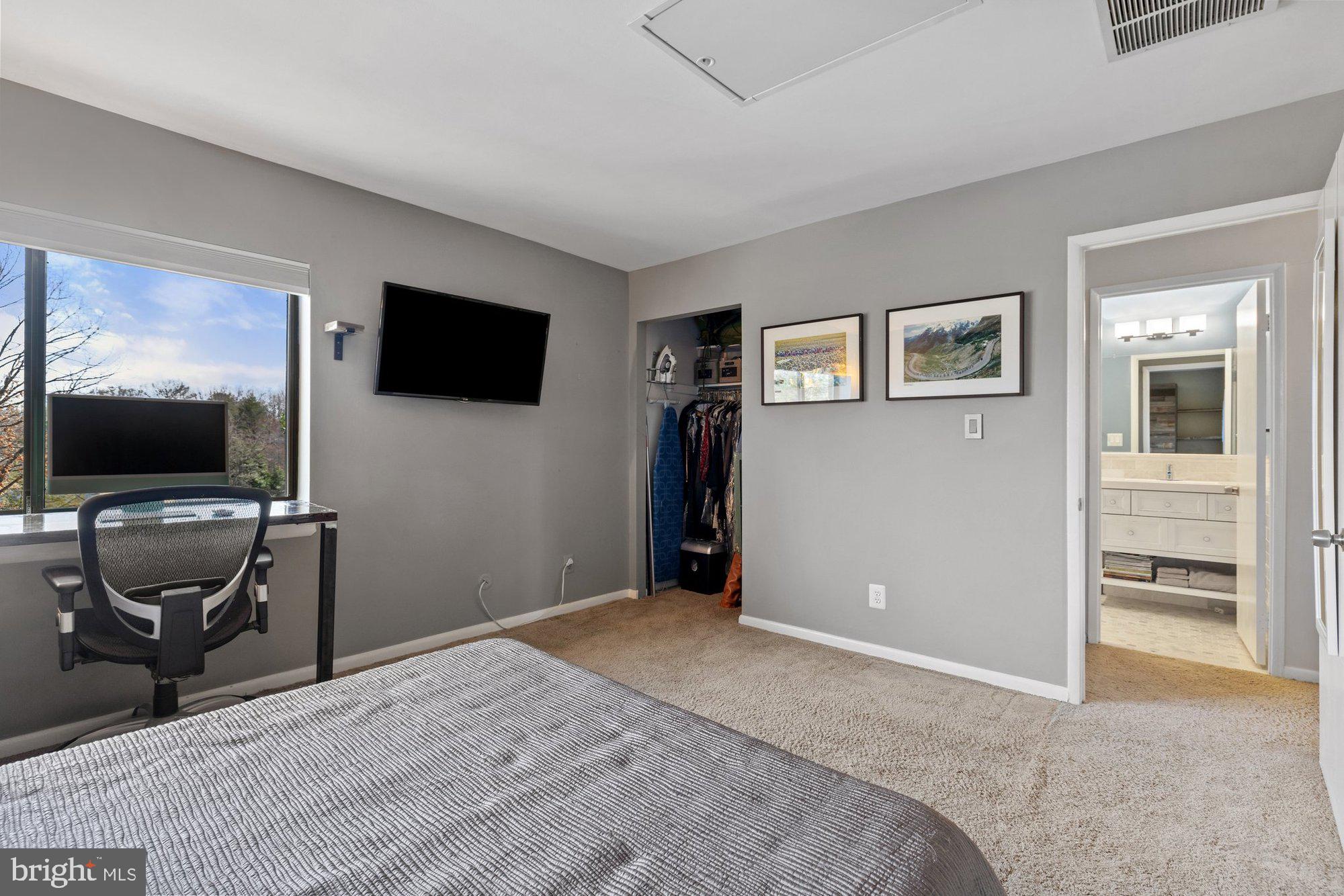 11120 Harbor Court, Unit 1120 Reston, VA 20191 - Photo 36 of 55 a bedroom with furniture and flat screen tv