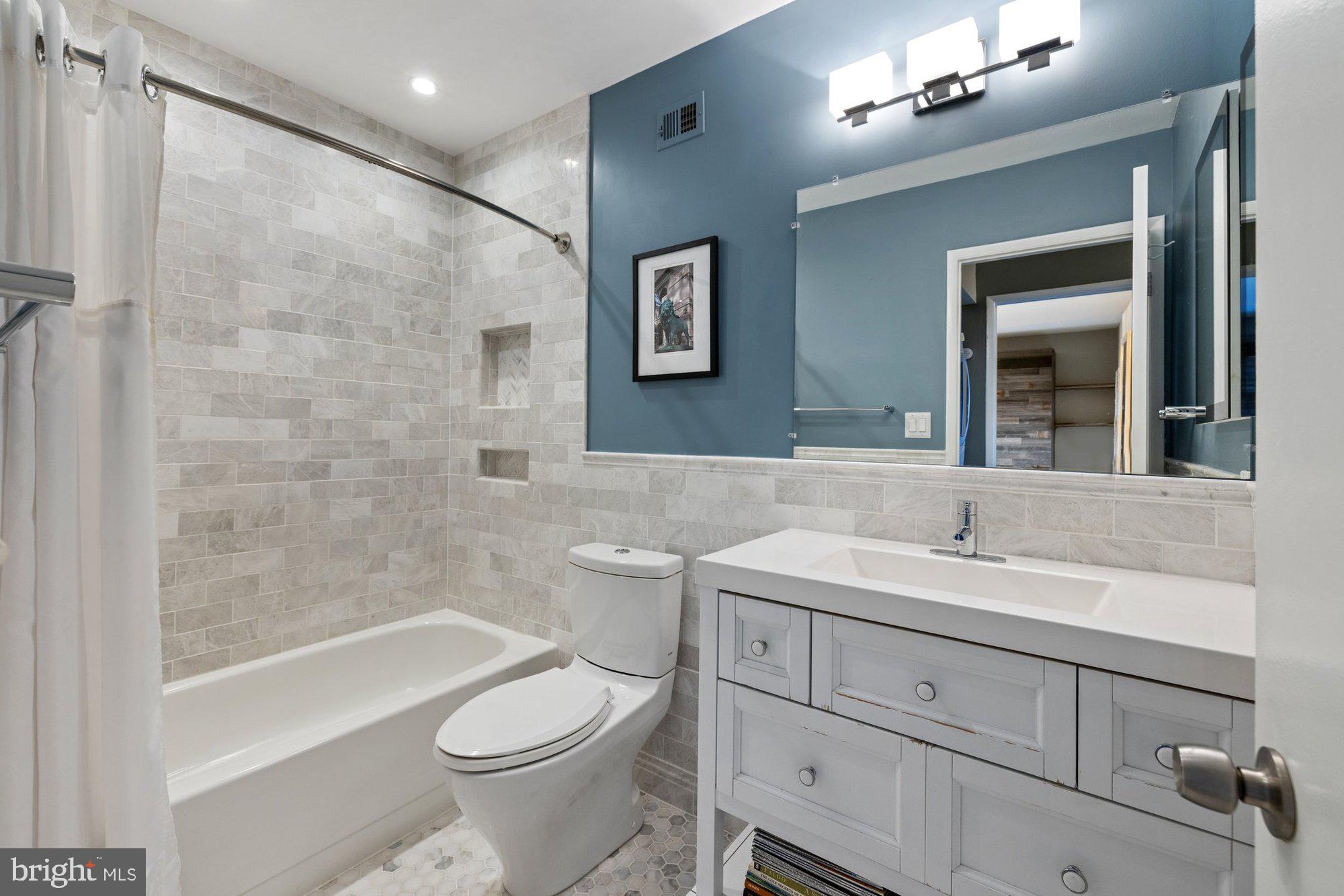 11120 Harbor Court, Unit 1120 Reston, VA 20191 - Photo 38 of 55 a bathroom with a toilet sink and mirror