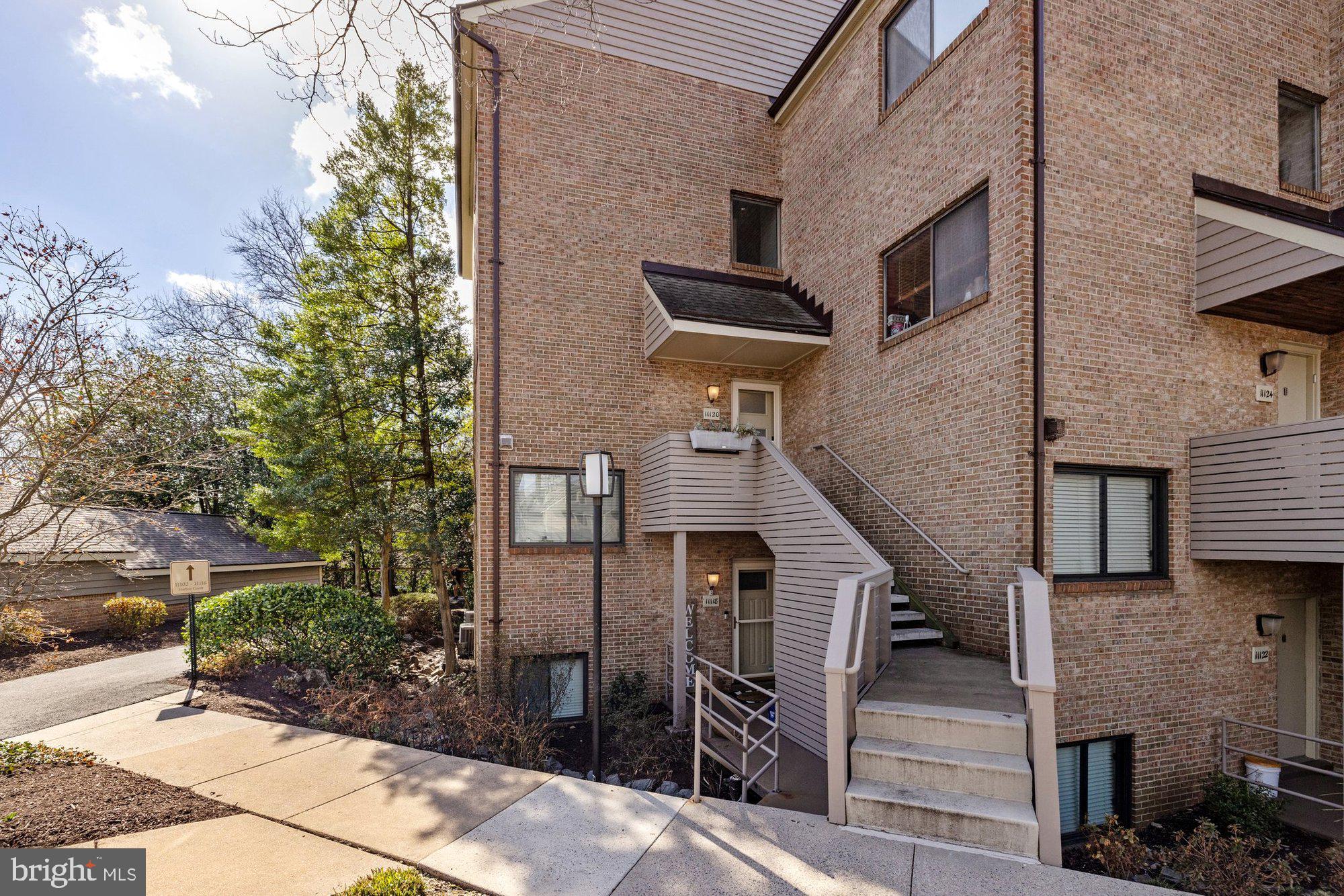 11120 Harbor Court, Unit 1120 Reston, VA 20191 - Photo 4 of 55 a front view of a house with stairs