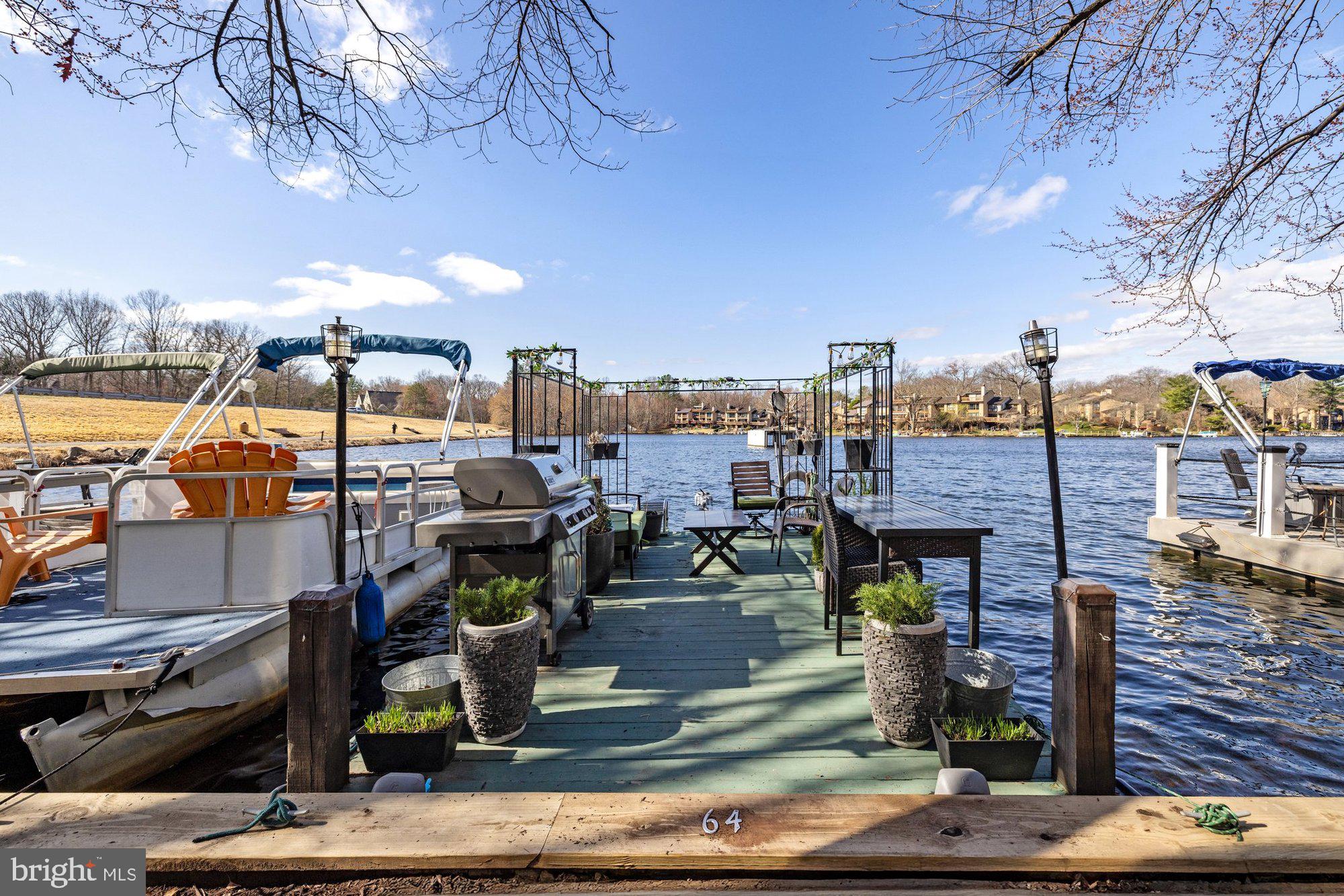 11120 Harbor Court, Unit 1120 Reston, VA 20191 - Photo 45 of 55 a view of a rooftop deck with dining table and chairs