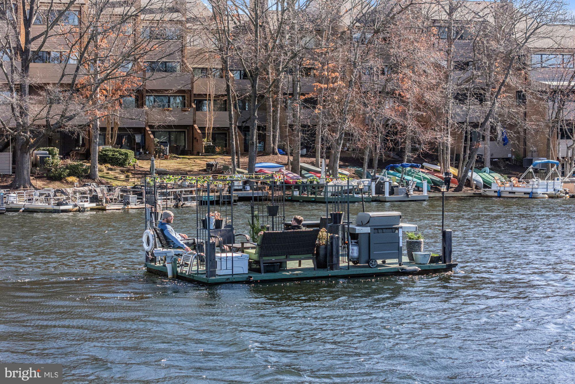 11120 Harbor Court, Unit 1120 Reston, VA 20191 - Photo 47 of 55 a view of a lake with sitting area