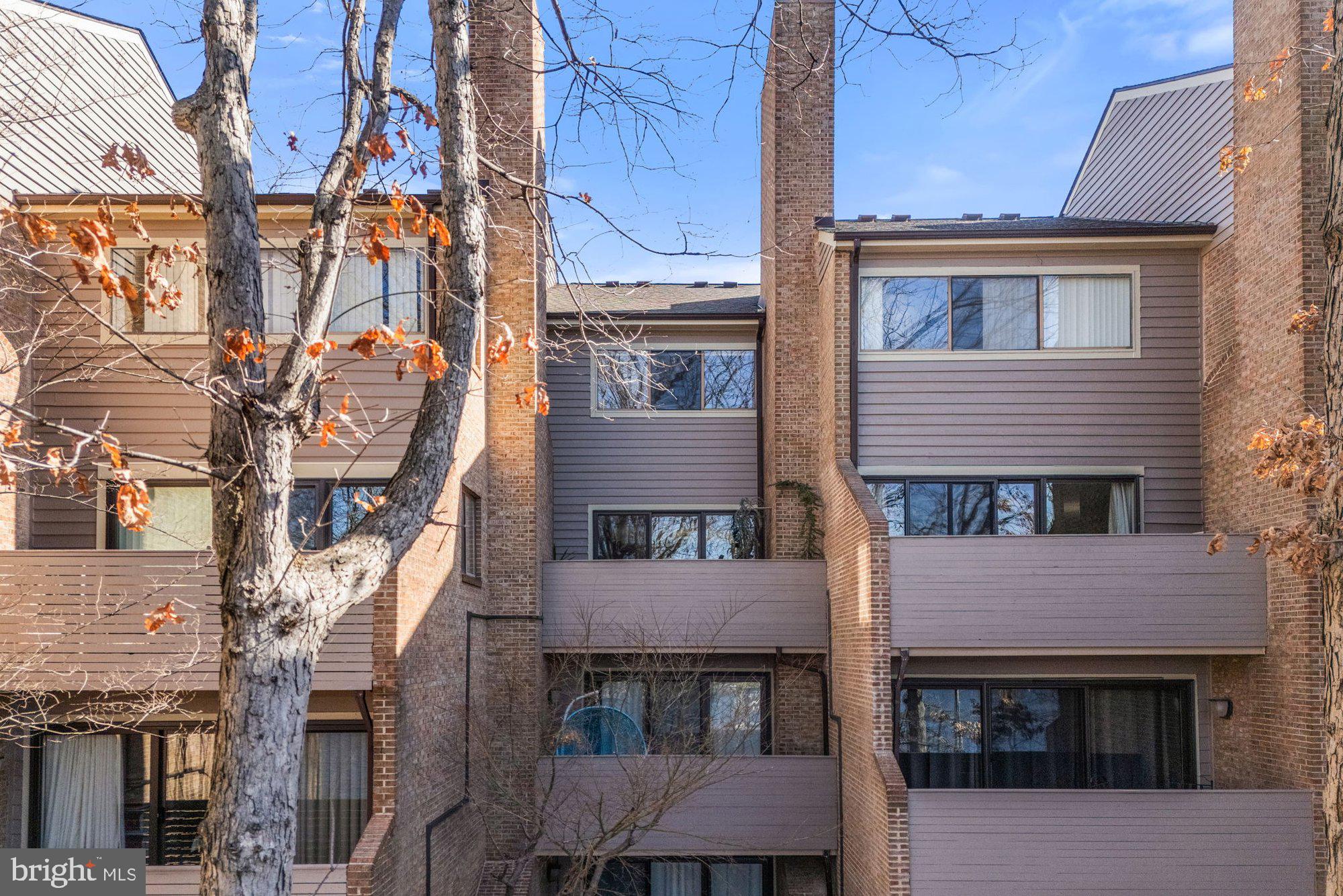 11120 Harbor Court, Unit 1120 Reston, VA 20191 - Photo 52 of 55 a front view of a building with a glass door