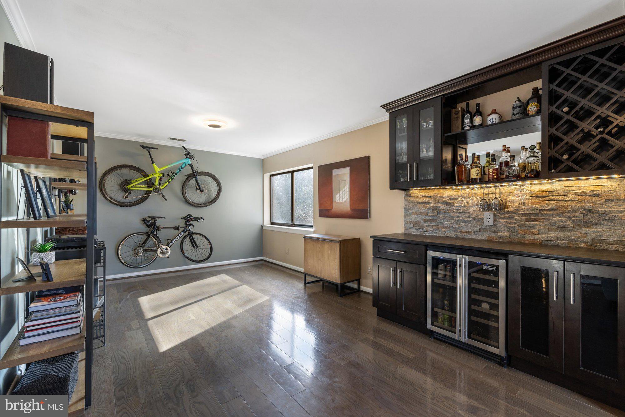 11120 Harbor Court, Unit 1120 Reston, VA 20191 - Photo 7 of 55 a living room with stainless steel appliances kitchen island granite countertop a stove and a wooden cabinets