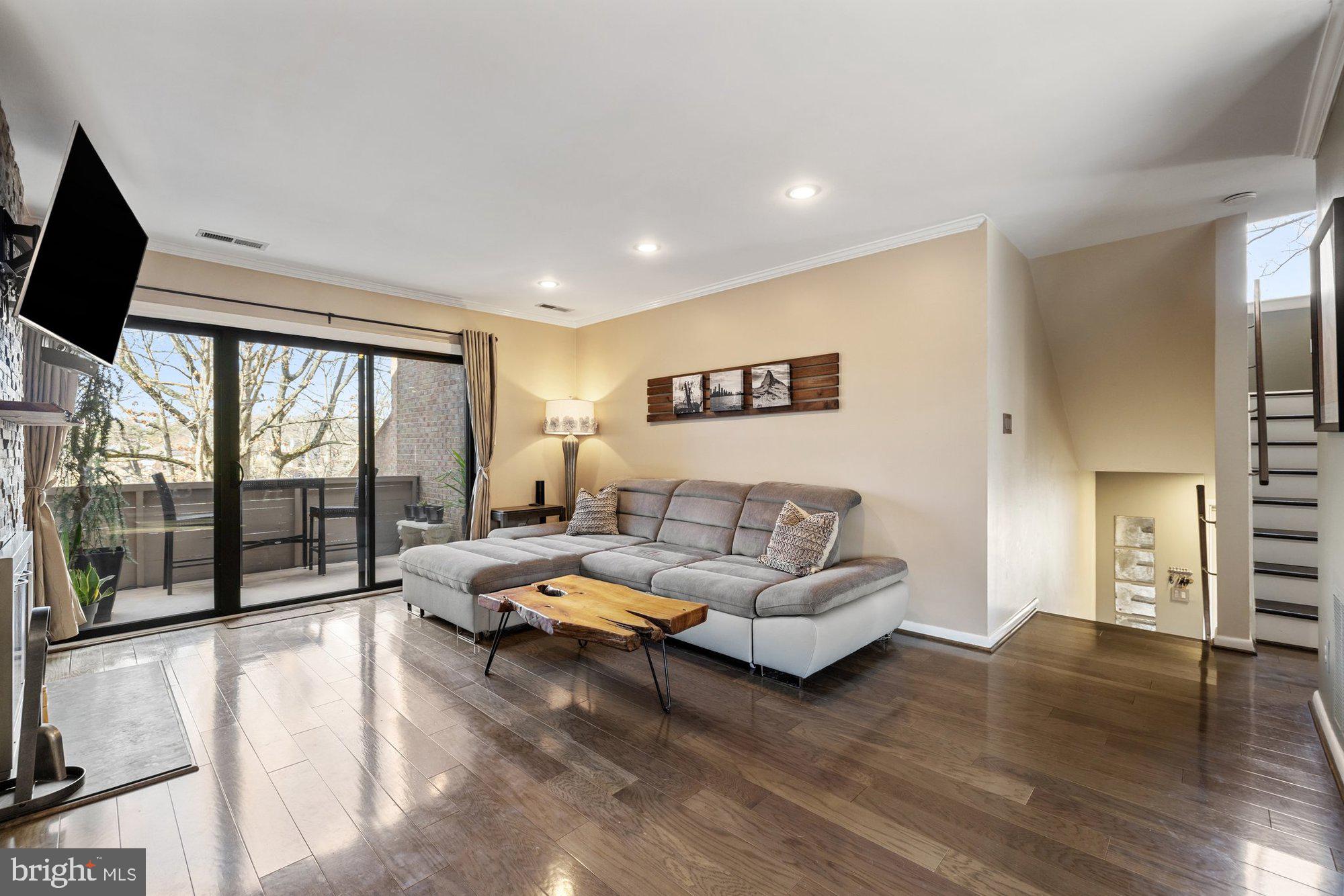 11120 Harbor Court, Unit 1120 Reston, VA 20191 - Photo 10 of 55 a living room with furniture and a large window