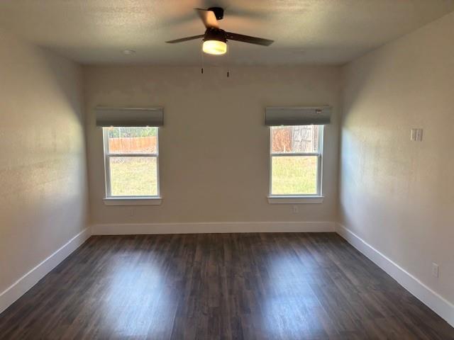 4707 Chapman Street Fort Worth, TX 76105 - Photo 11 of 21 wooden floor in an empty room with a window