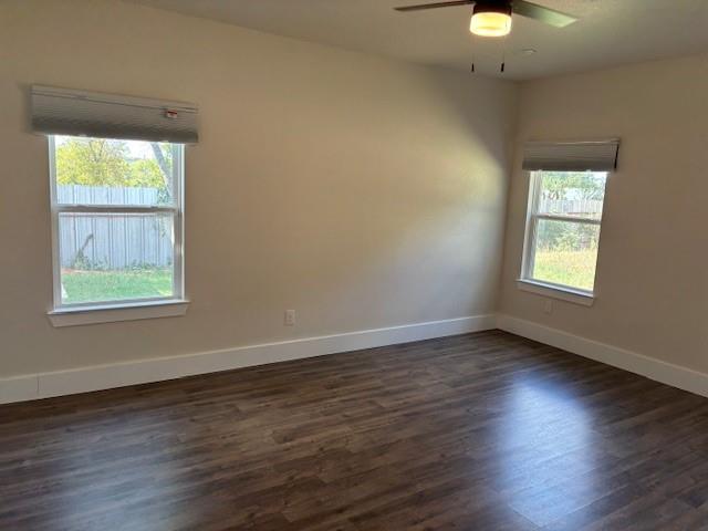 4707 Chapman Street Fort Worth, TX 76105 - Photo 12 of 21 an empty room with wooden floor and windows