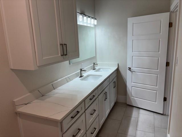 4707 Chapman Street Fort Worth, TX 76105 - Photo 14 of 21 a bathroom with a sink and a mirror