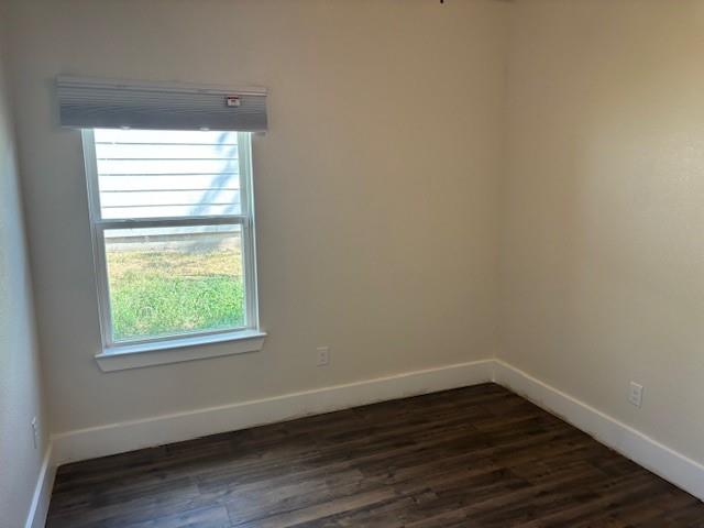 4707 Chapman Street Fort Worth, TX 76105 - Photo 16 of 21 a view of a small space with wooden floor and a window
