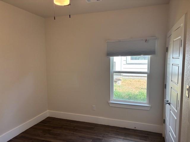 4707 Chapman Street Fort Worth, TX 76105 - Photo 17 of 21 an empty room with wooden floor and windows