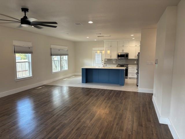 4707 Chapman Street Fort Worth, TX 76105 - Photo 3 of 21 a view of kitchen and hall with wooden floor
