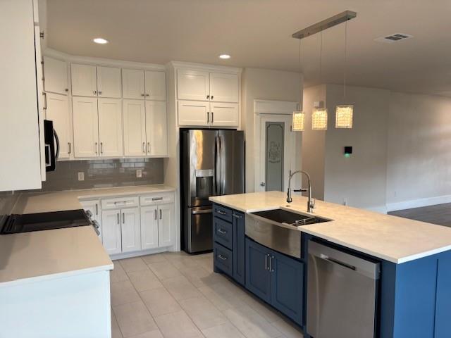 4707 Chapman Street Fort Worth, TX 76105 - Photo 6 of 21 a kitchen with a sink refrigerator and cabinets