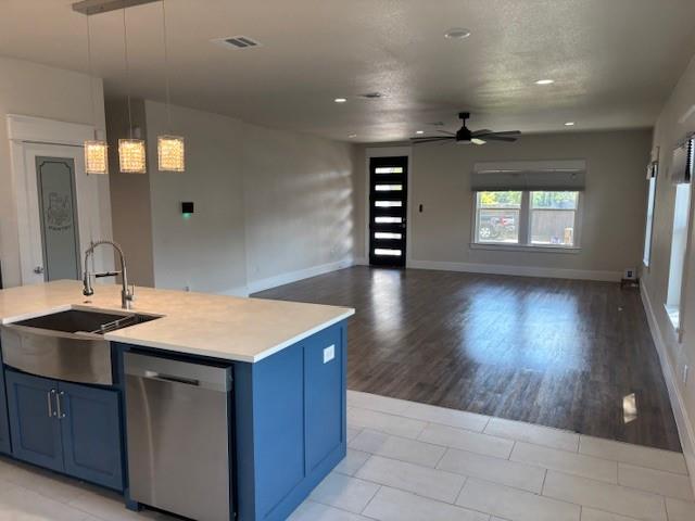 4707 Chapman Street Fort Worth, TX 76105 - Photo 7 of 21 a kitchen with a wooden floor and a sink