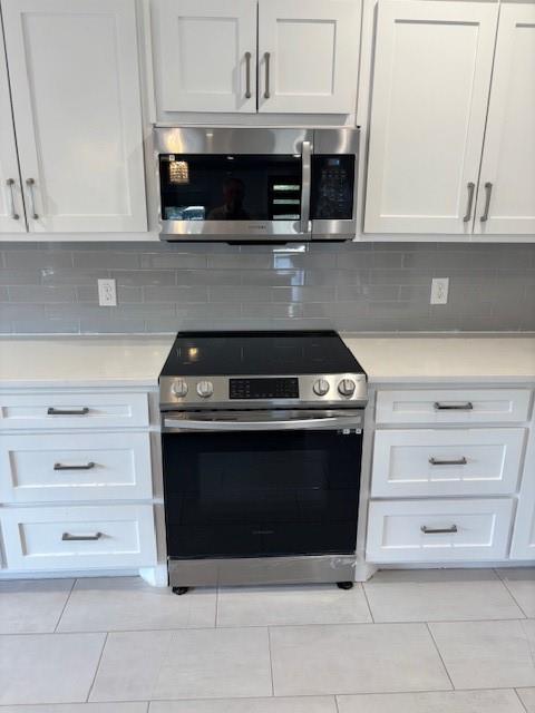 4707 Chapman Street Fort Worth, TX 76105 - Photo 9 of 21 a stove top oven sitting inside of a kitchen