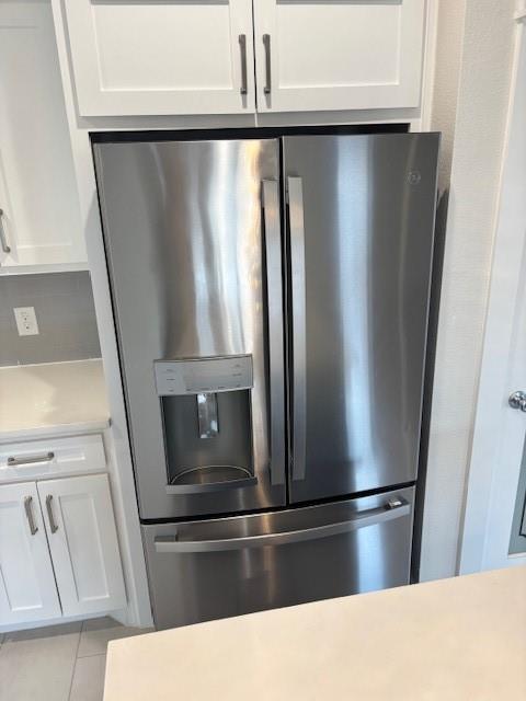4707 Chapman Street Fort Worth, TX 76105 - Photo 10 of 21 a view of a refrigerator in kitchen with stainless steel appliances wooden floor