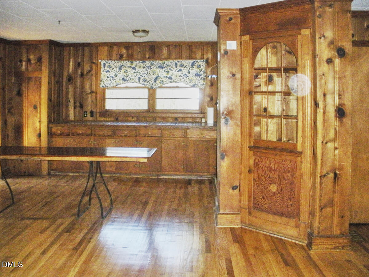 4204 Kerley Road Durham, NC 27705 - Photo 8 of 34 a living room with a large window and wooden floor