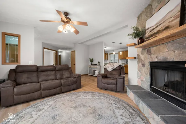 a living room with furniture and a fireplace