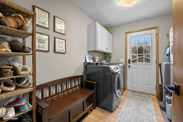 a kitchen with stainless steel appliances granite countertop a stove a refrigerator and a cabinets
