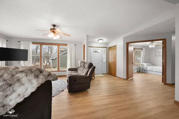 a living room with furniture and a large window