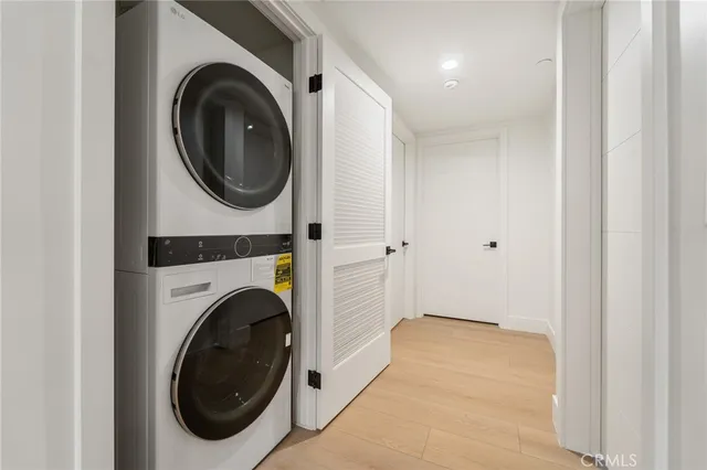 a view of a hallway with washer and dryer