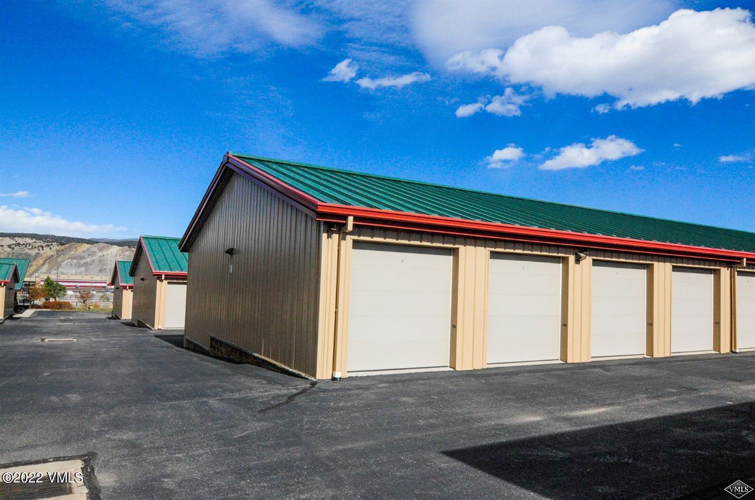 55 Spring Creek Circle, Unit 101 Gypsum, CO 81637 - Photo 14 of 18 a front view of a house with a garage