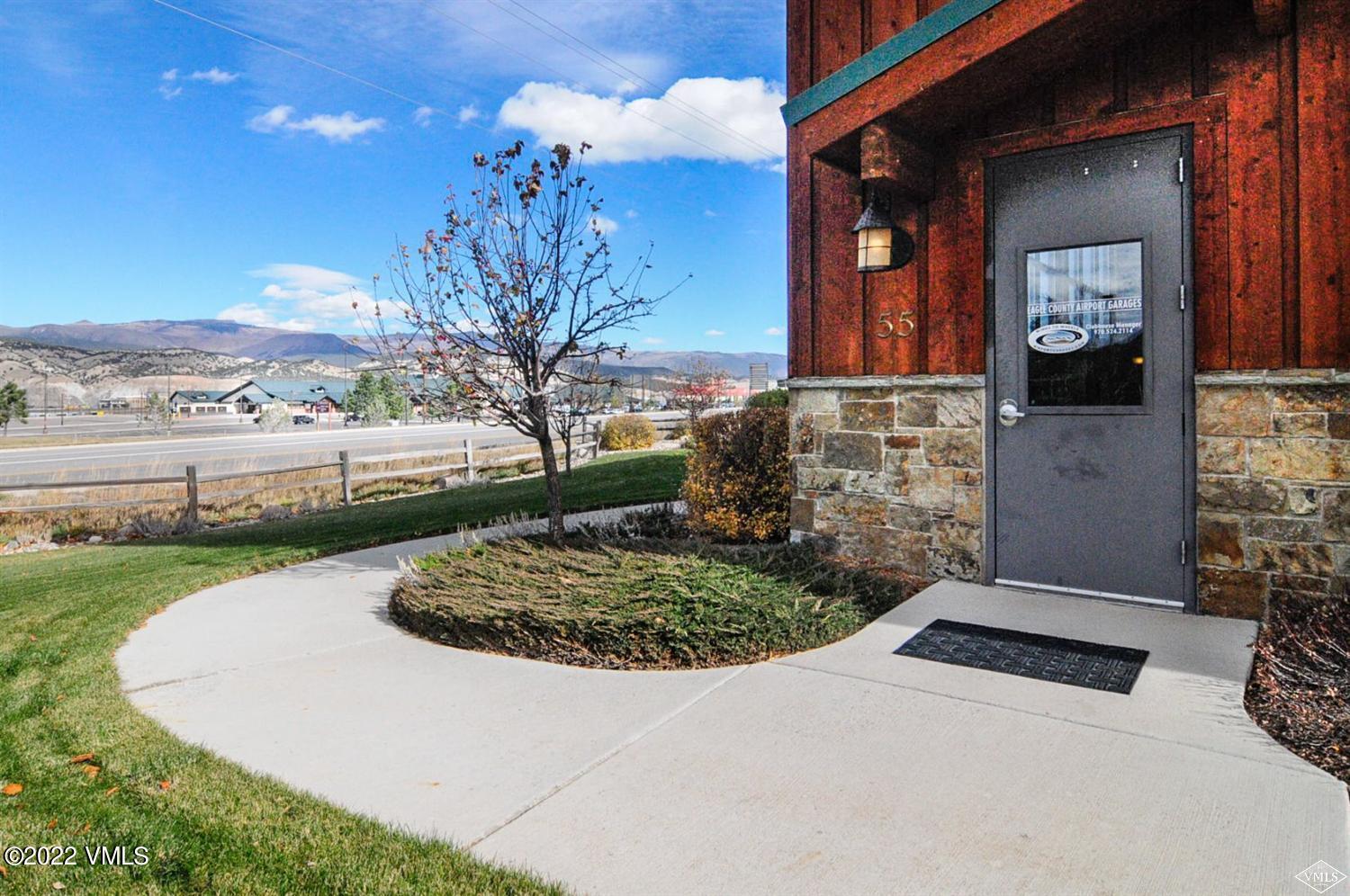 55 Spring Creek Circle, Unit 101 Gypsum, CO 81637 - Photo 16 of 18 a view of a house with a yard