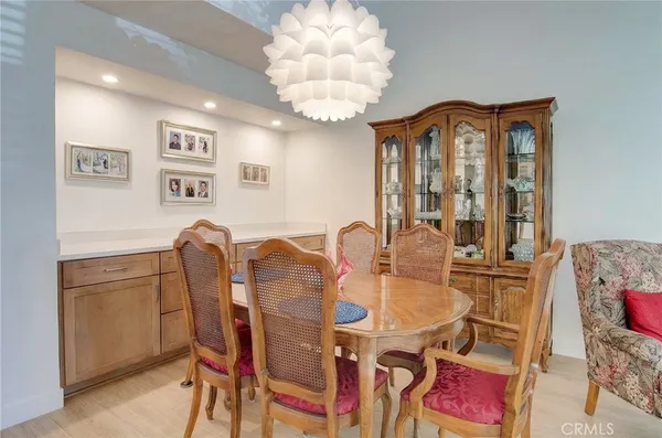 a view of a dining room with furniture and a large window