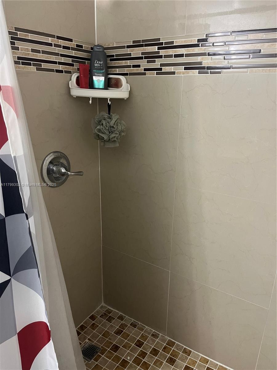 8145 Northwest 7th Street, Unit 211 Miami, FL 33126 - Photo 15 of 23 a bathroom with a shower