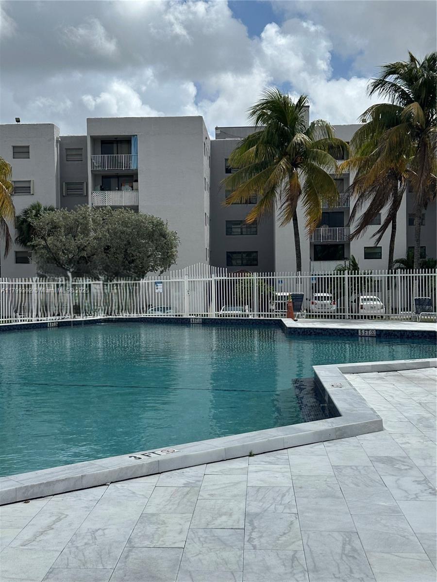 8145 Northwest 7th Street, Unit 211 Miami, FL 33126 - Photo 2 of 23 a view of a house with a yard