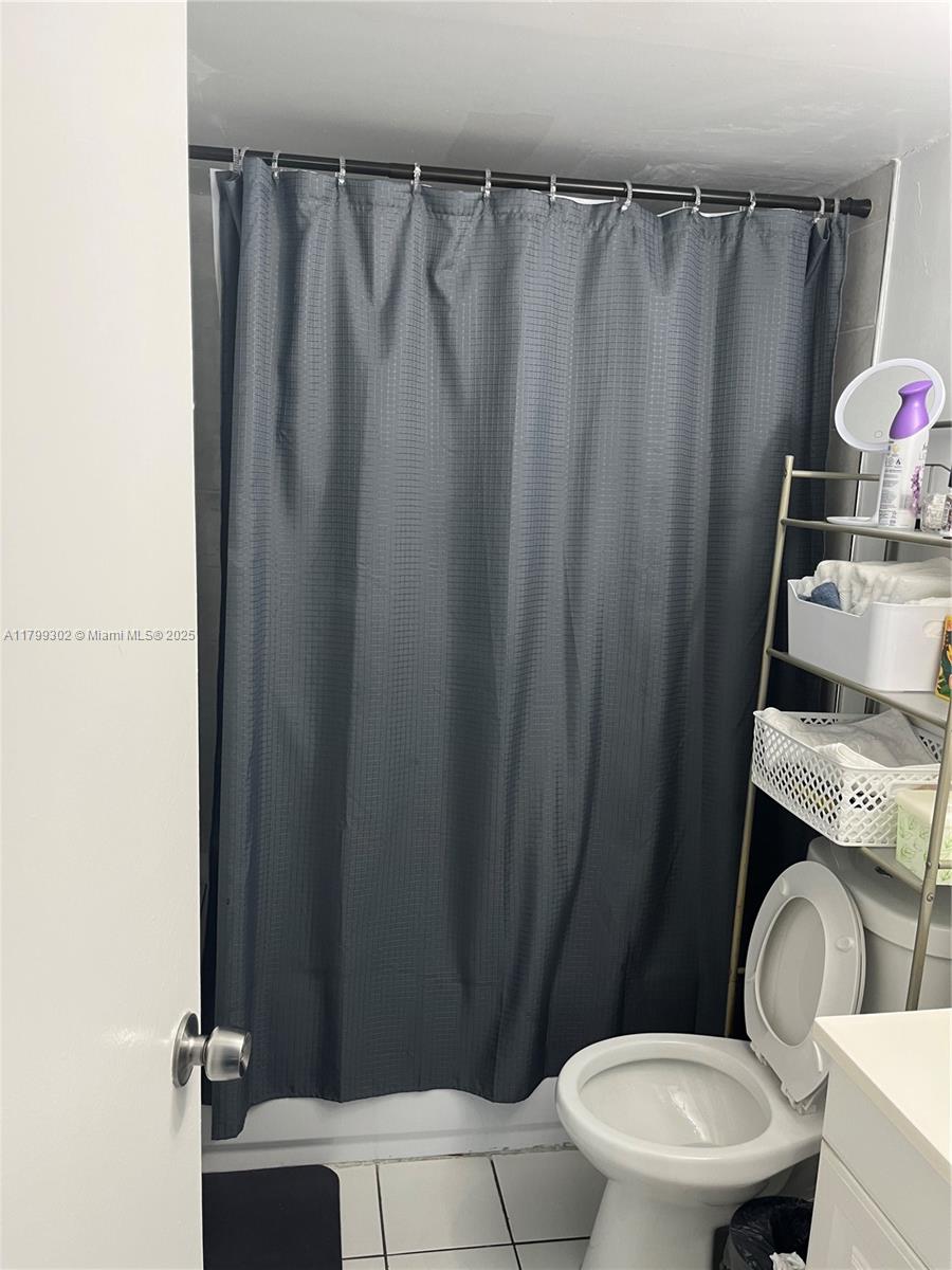 8145 Northwest 7th Street, Unit 211 Miami, FL 33126 - Photo 23 of 23 a bathroom with a sink and a toilet