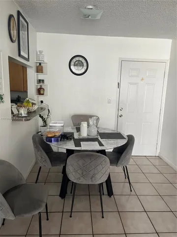 a view of a workspace with furniture