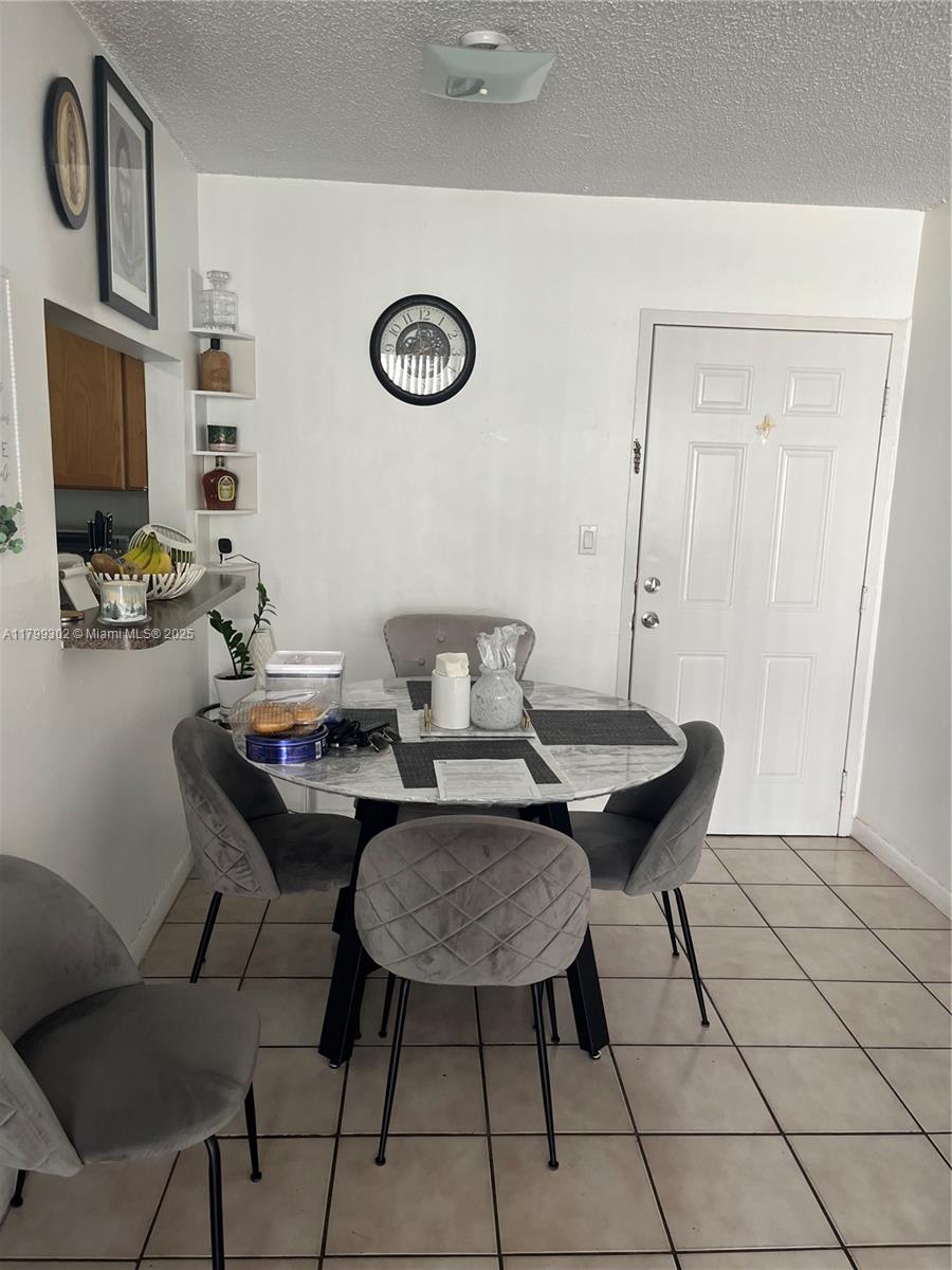 8145 Northwest 7th Street, Unit 211 Miami, FL 33126 - Photo 8 of 23 a view of a workspace with furniture