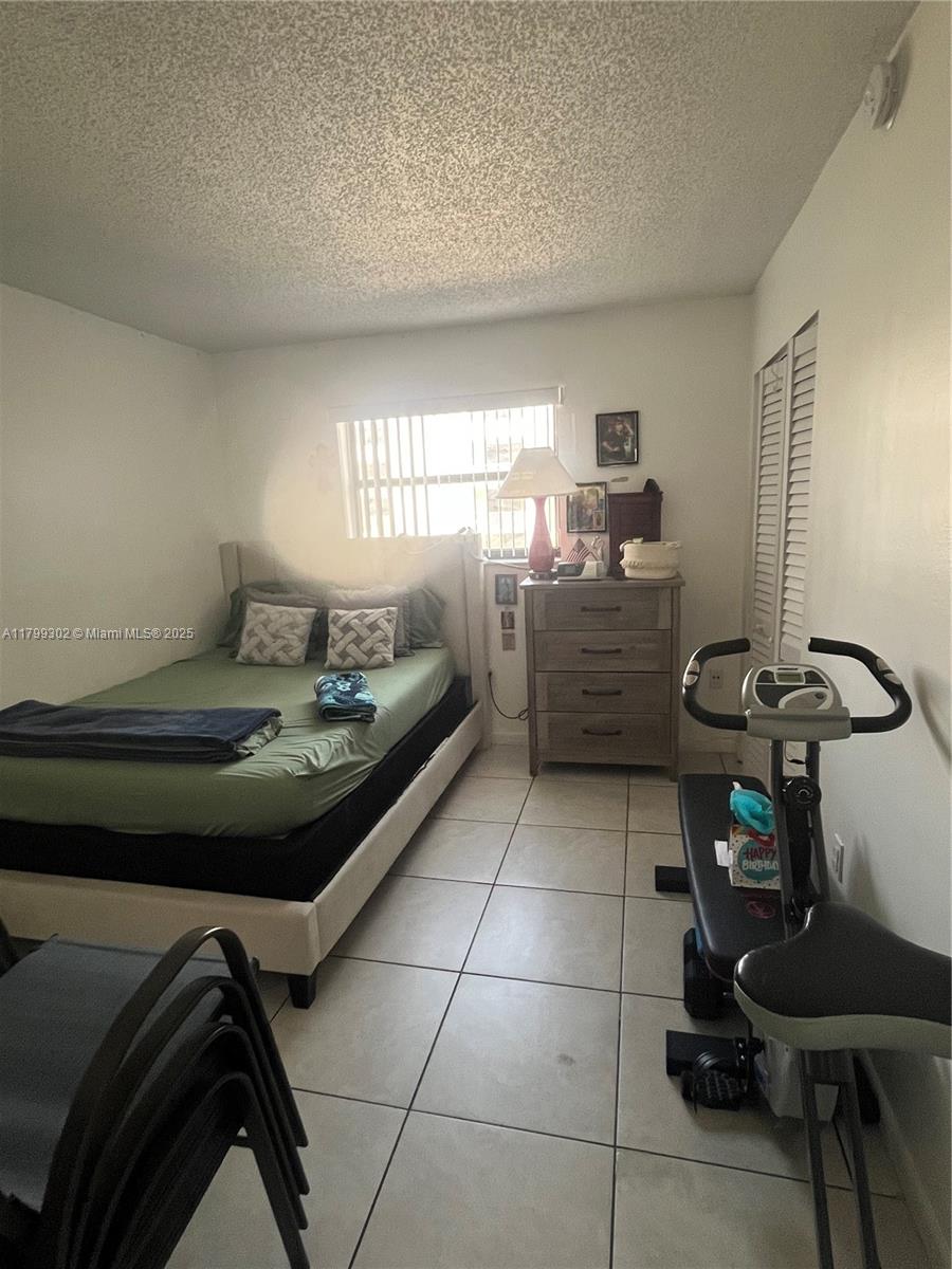 8145 Northwest 7th Street, Unit 211 Miami, FL 33126 - Photo 9 of 23 a room with storage and utility