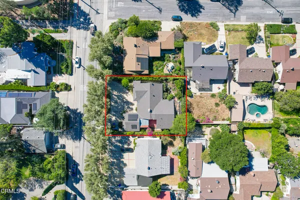 an aerial view of houses with outdoor space