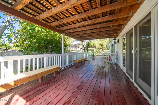 a view of balcony with wooden floor