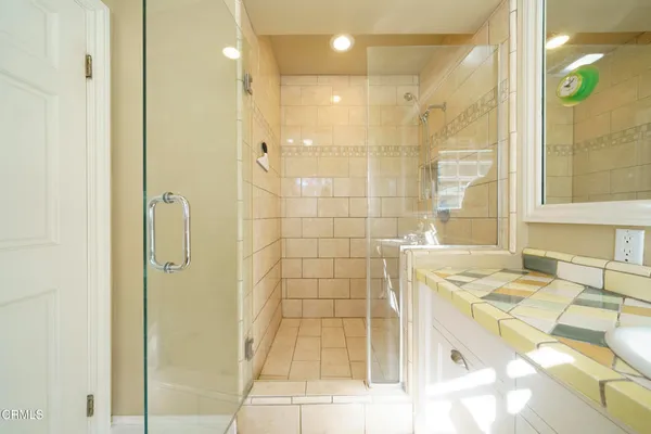 a bathroom with a bathtub and shower