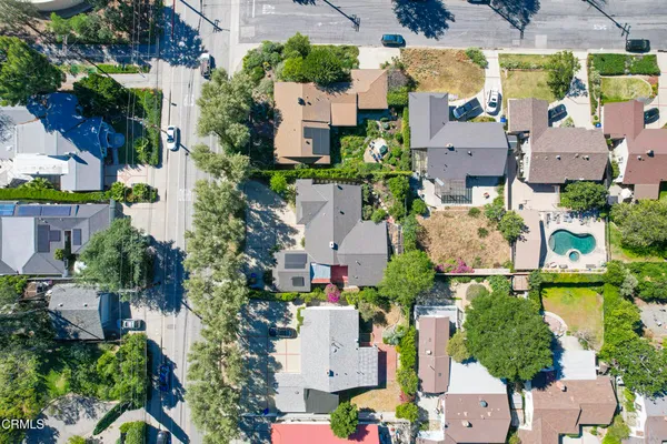 an aerial view of houses with outdoor space
